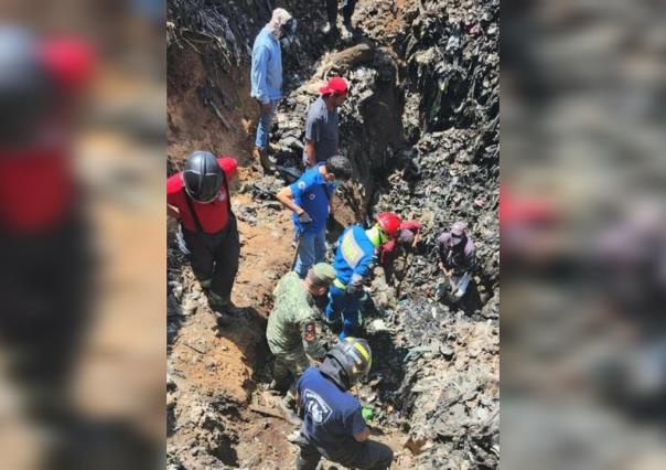 Sigue la búsqueda de trabajador enterrado bajo toneladas de basura en Nuacalpan