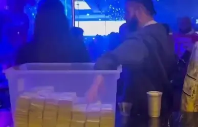 Aparece Drake con caja de plástico llena de dinero en club de stripers