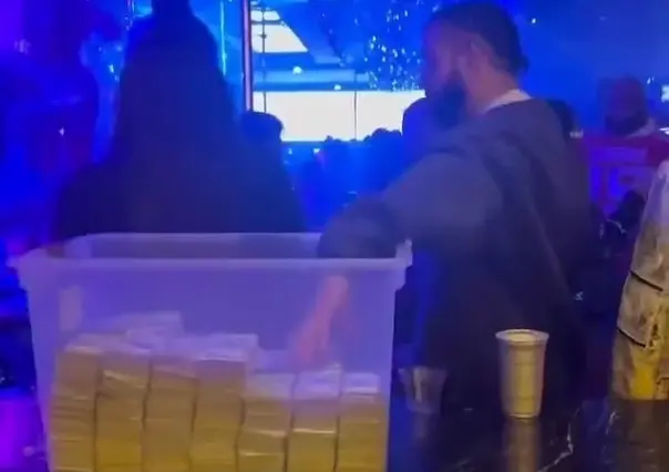 Aparece Drake con caja de plástico llena de dinero en club de stripers