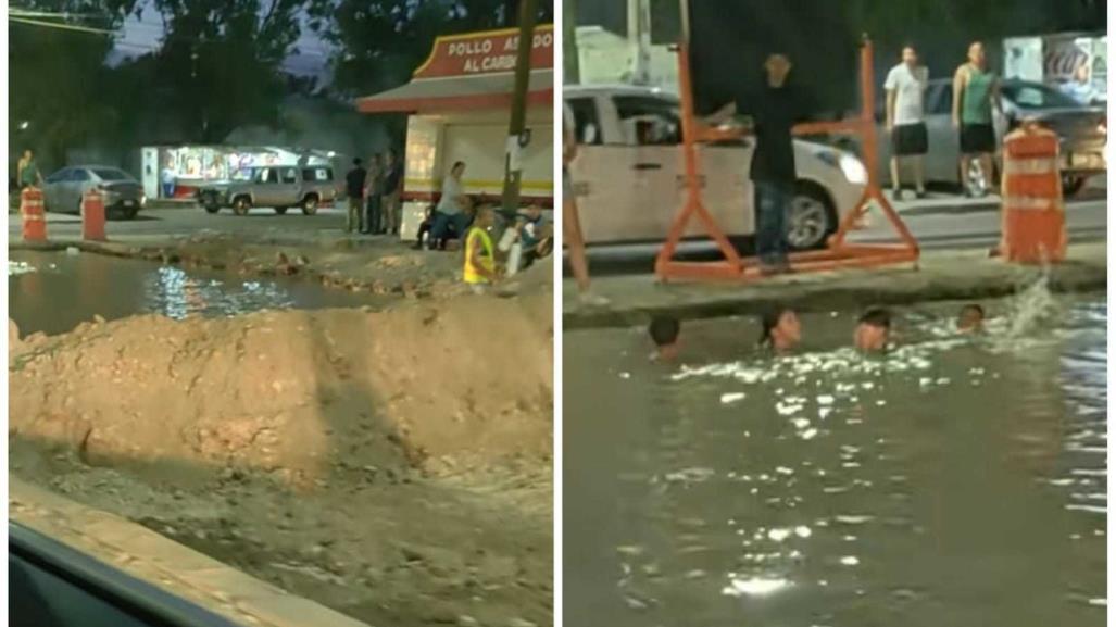 Niños aprovechan obra pública en avenida y se meten a nadar (VIDEO)