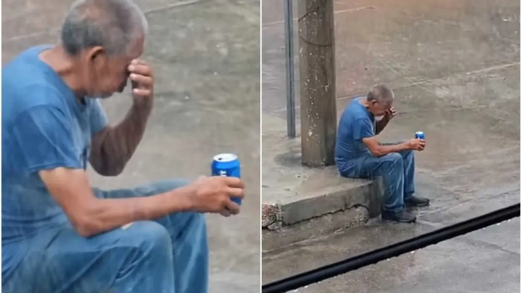 ¡La lata bajo la lluvia! Graban a hombre triste tomando bajo aguacero (VIDEO)