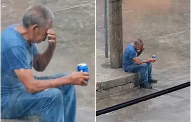 ¡La lata bajo la lluvia! Graban a hombre triste tomando bajo aguacero (VIDEO)