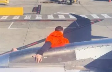 Arrestan a hombre por correr por el ala de un avión en aeropuerto de Australia