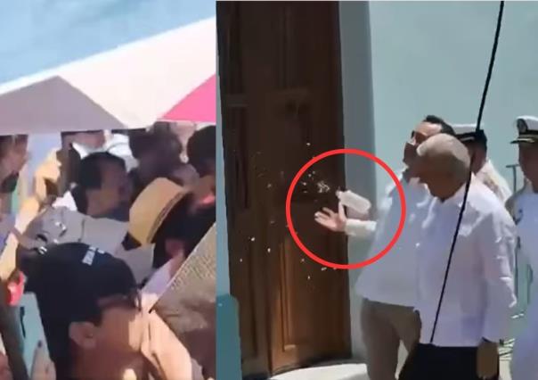 (VIDEO) Manifestantes lanzan botellas y gritan dictador a AMLO en Veracruz