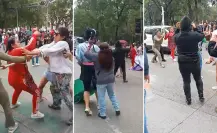 Manifestantes y comerciantes ambulantes se pelean a golpes en Avenida Juárez | VIDEO