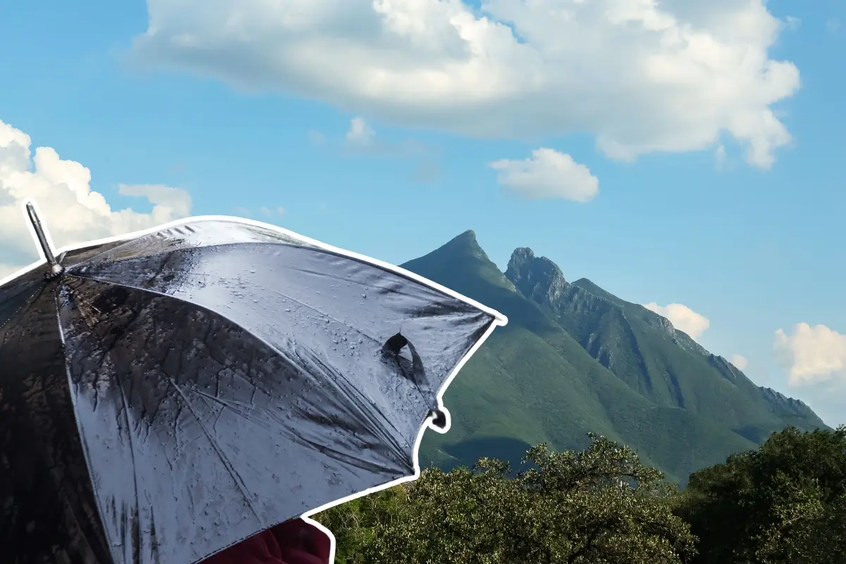 El cerro de la Silla y una persona con paraguas. Foto: Canva