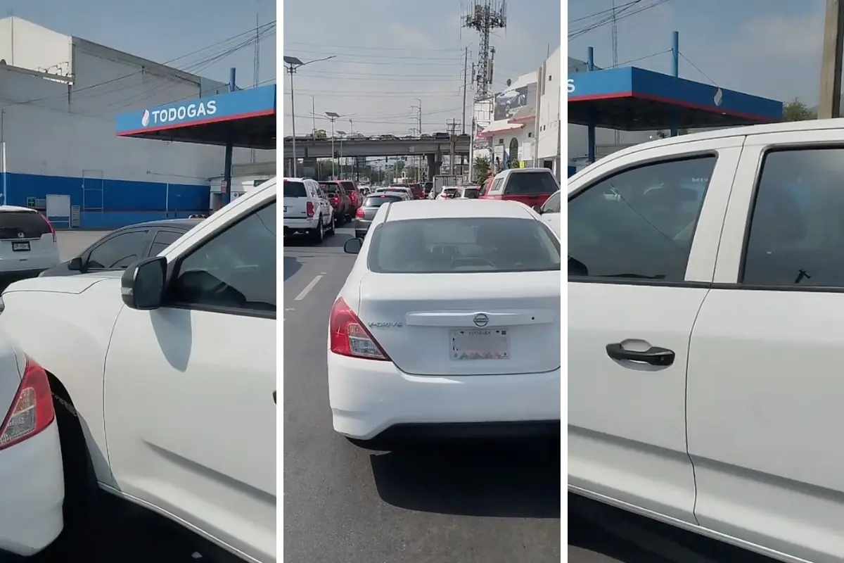 Un vehículo Versa y una camioneta sobre avenida en Monterrey. Foto: Canva