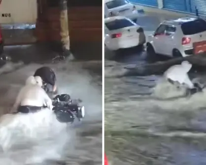 VIDEO | Joven arriesga su vida para salvar su moto de las inundaciones en Edomex