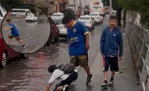 Niños cruzan calle inundada sin supervisión en medio de fuertes lluvias en Saltillo