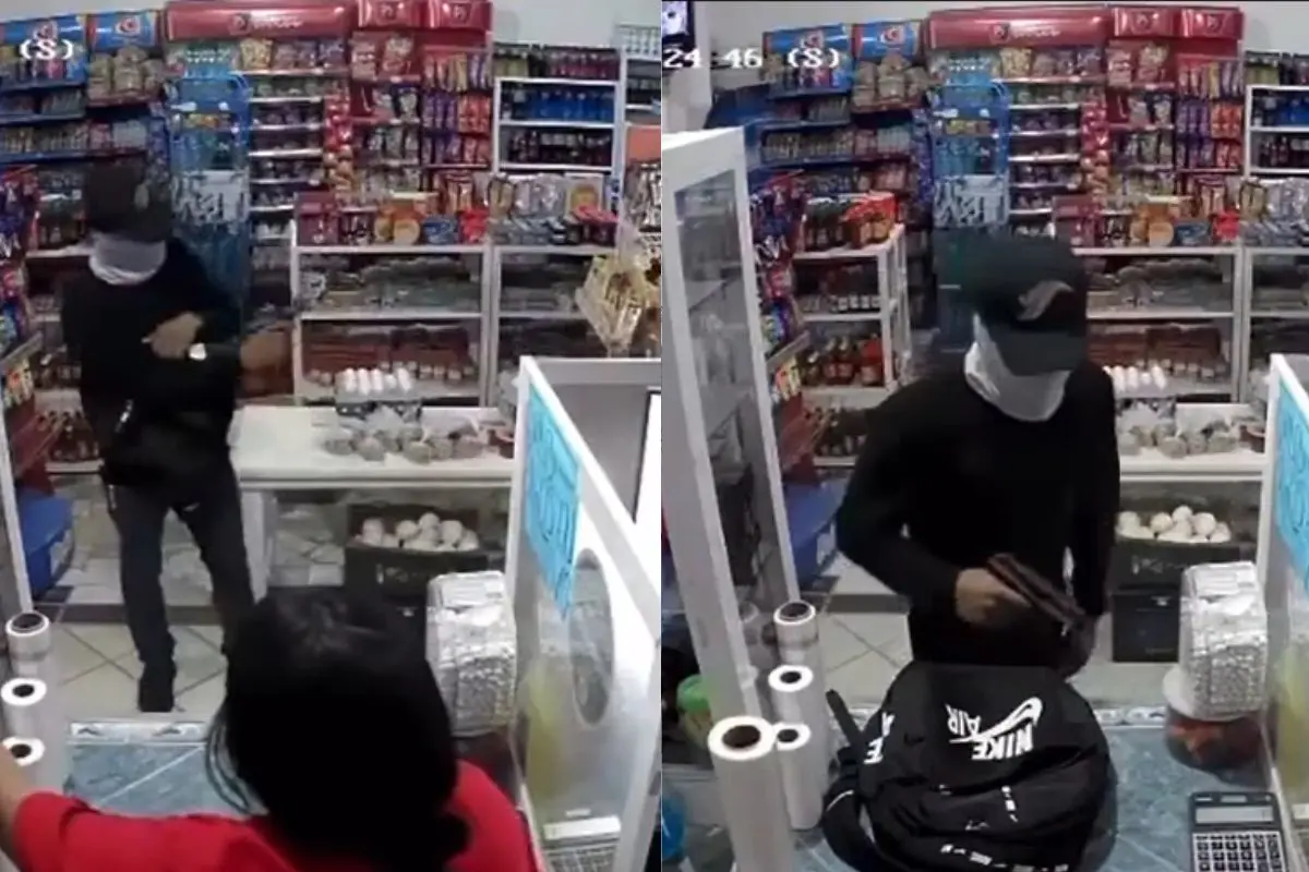 Captura del video viral donde se observa al hombre armado durante el asalto en Cabo San Lucas. Foto: Facebook / SOS Rotativo