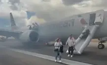Pasajeros evacuan avión de American Airlines tras incendio en rueda principal