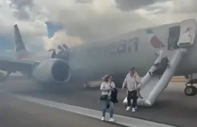 Pasajeros evacuan avión de American Airlines tras incendio en rueda principal