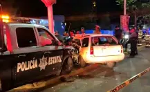 Patrulla de la Policía Estatal choca contra auto de una familia frente al Parque Guadiana
